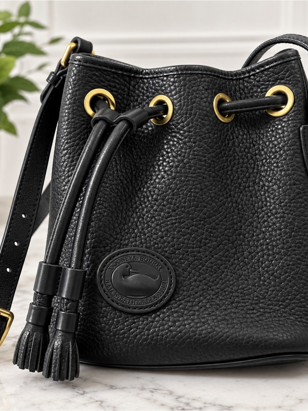 Dooney & Bourke Black Pebbled Leather Drawstring Bucket Bag with Gold Hardware